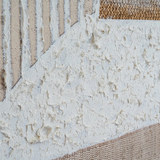 Close detail of the thick, rough white texture applied to the canvas, contrasting with woven beige and brown fabric sections.