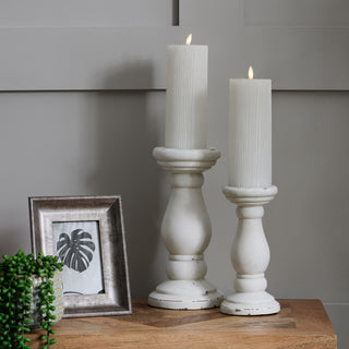 Matt white ceramic holder displayed next to a taller matching holder on a wooden side table.
