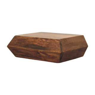 Dark wood wall unit viewed from below, showing the geometric angled facets and natural wood grain.