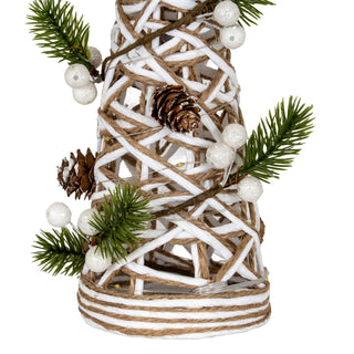 Close detail of the white rattan and brown twine weave, decorated with artificial pine, glitter berries, and cones.