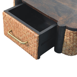 Close-up showing the drawer pulled open, revealing the dark interior and the brass curved handle.