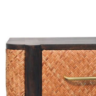 Close detail of the curved wooden top edge and herringbone rattan weave.