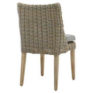 Rear view of the grey woven rattan dining chair showing the full back and four wooden legs.