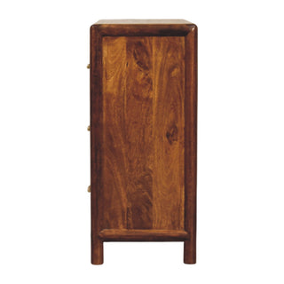 Side profile of the chest, showing the rounded edges, deep wood tone, and integrated legs.