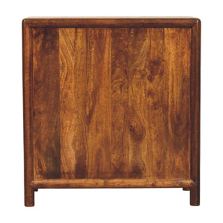 Detail of the chest's solid back panel, showing the rich wood grain, framed construction, and integrated feet.
