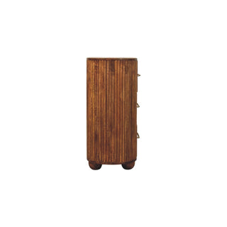 End view of the amber oak chest highlighting the cylindrical shape, vertical ridges, and spherical feet.