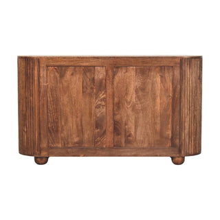 Back view of the wooden chest showing the panelled construction, rounded ridged sides, and spherical feet.