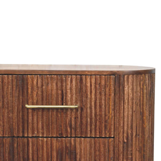 Close-up showing the ridged wood texture, rounded side panel, and brass bar handle on the roasted almond chest.