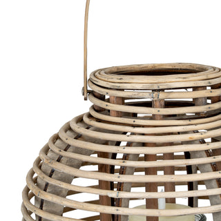 Close detail showing the tapering shape of the round willow lantern and the attachment point for the carrying handle.