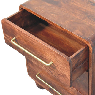 Dark wood chest detail: top drawer open, showing the internal structure and brass handle.