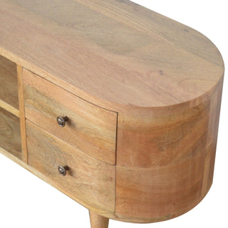 Detailed view of the rounded end and top surface, showing the natural wood grain and two drawers with metal handles.