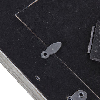 Close-up of the back of the rustic grey frame showing the black swivel clips securing the backing board.