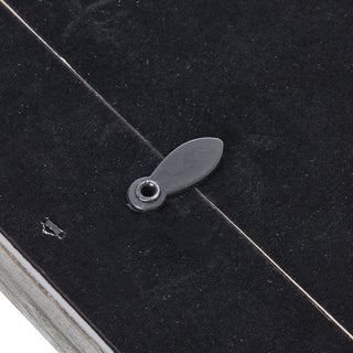 Detail of the back of the grey frame, showing the swivel clip securing the black backing board.