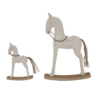 Large whitewashed wooden rocking horse displayed next to a smaller matching sculpture.