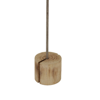 Close up of the rustic wood block base showing the grain and the metal support stem insertion.