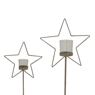 Two sizes of the rustic metal star candle holder frame and glass votives on stems, isolated.