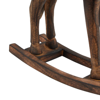 Detailed view of the rustic wooden rocking horse's carved legs and the curved rocking base.