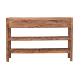 Front view of the wooden console table showing the top drawer panel and two lower shelves with woven rattan inlay.