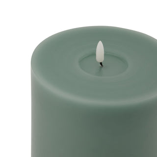 Close-up of the sage LED candle top showing the melted wax effect and the white faux flame element.