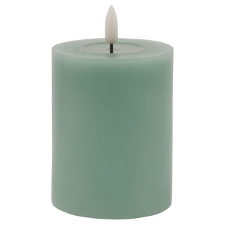 Plain studio shot of a sage LED wax pillar candle.