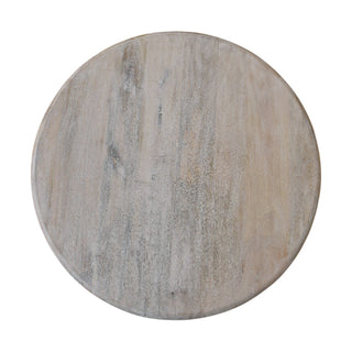 Distressed whitewashed surface of the round salted oak coffee table viewed from directly above.