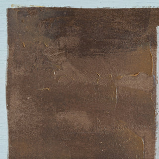 Detail of the abstract artwork showing the dense, dark brown paint texture with glossy, raised sections and rough canvas.