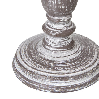 Close up of the turned wooden base and circular foot, showing the distressed grey and white paint finish.