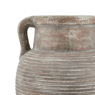 Close detail of the amphora pot showing the weathered brown ceramic finish and ridged surface.