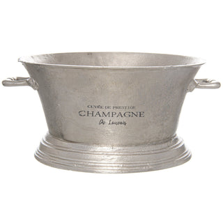 Silver metal champagne cooler, textured finish, with side handles and black text reading Cuvée de Prestige Champagne.
