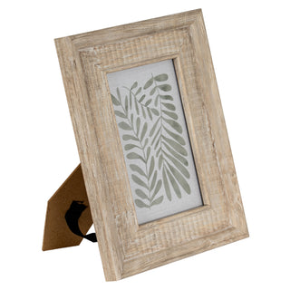 Distressed light wood frame standing upright, viewed from an angle showing the easel back support.