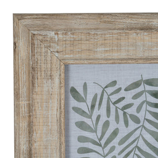Detail of the distressed wood frame corner and the light grey insert with a pattern of green fronds.