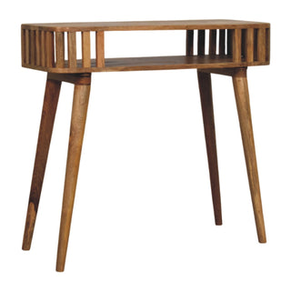 Three-quarter view of the wooden console table with slatted sides and tapered legs.
