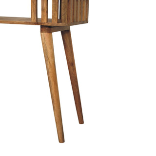 Detail showing the two angled, tapered wooden legs beneath the slatted console structure.