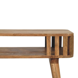 Detail of the wooden console table showing the slatted side panel, rounded corner, and shelf structure.