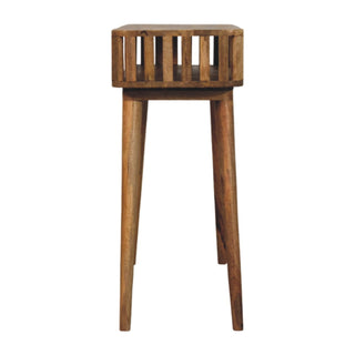 Narrow profile view of the wooden console table showing the depth of the slatted shelf and the tall, tapered legs.