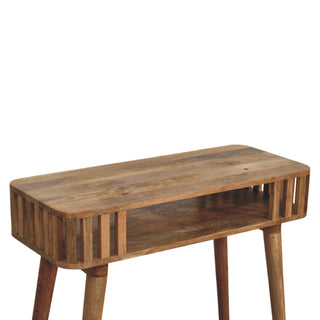Detail shot of the console table's wooden top surface, rounded edges, and the open shelf section with vertical slatted ends.
