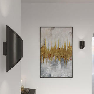 Large black wall lamp on a corner wall, with a smaller lamp positioned beside abstract gold artwork.