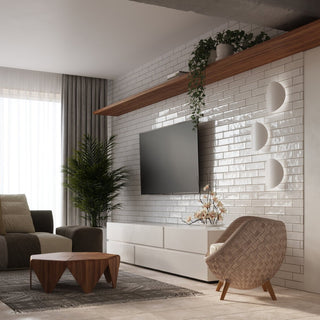 Three white asymmetrical wall lights positioned next to a television screen on a white brick-tiled wall.