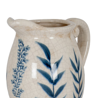 Close-up of the ceramic jug showing the spout, handle, crackle glaze, and blue leaf pattern detail.