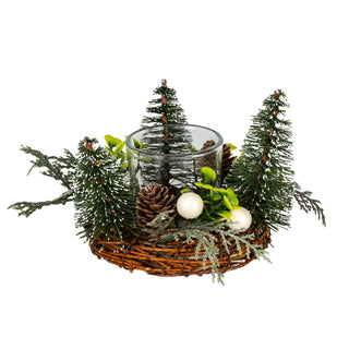 Small wicker wreath with glass votive, artificial brush trees, pinecones, green foliage, and white berries.