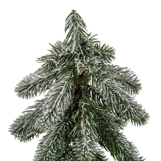 Detail shot showing the green artificial pine needles heavily dusted with white flocking.