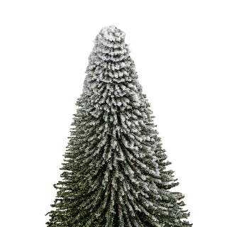 Detailed view of the top section of the conical brush tree, highlighting the dense white flocking.