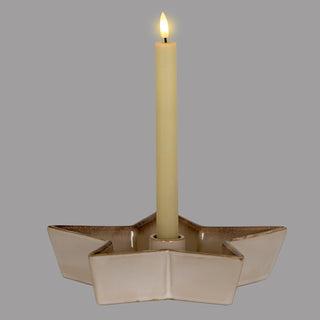 Star-shaped ceramic holder with cream glaze and brown speckled edges, holding a lit LED candle.