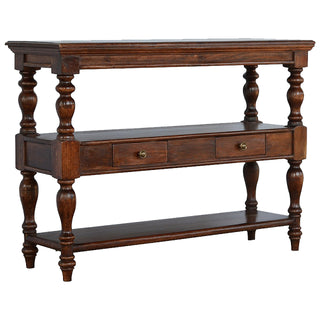 Full view of the dark stained solid wood console table featuring decorative turned supports and brass drawer pulls.
