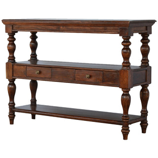 Front view of the solid wood console table showing turned legs, two drawers, and a lower shelf.