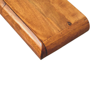 Close-up of the dark wood surface, focusing on the curved corner joint and rich grain.
