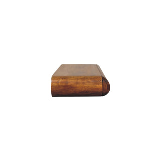 Low angle view showing the thickness and rounded front profile of the dark wood console.