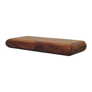 Dark wood console table viewed from above, highlighting the thick, rounded profile.