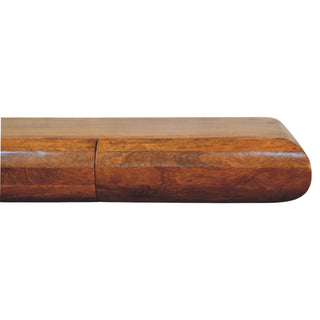 Close detail of the polished dark wood console showing the rounded end and drawer division.
