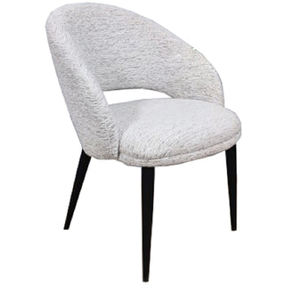 Light grey textured upholstered dining chair with curved back and black tapered legs, shown in a three-quarter view.